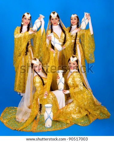 Five girls in Iranian dress with a blue background