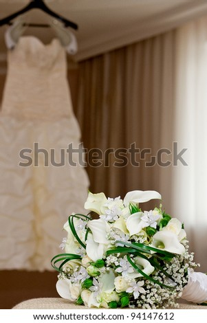 bridal bouquet and bridesmaid dress