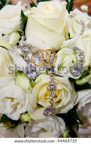stock photo Wedding rings with flowers