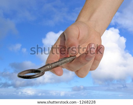 Hand reaching down, handing you a key.  (Clipping path included)