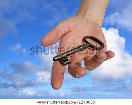 A hand reaching down from the sky, handing you a key. (Clipping path included)