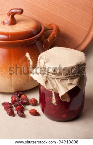 Still Life with a jar of jam and a ceramic pot