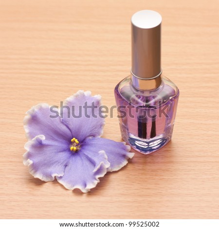 nail polish and a violet flower