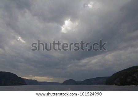 Saguenay river under dark clouds.