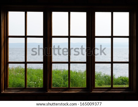 Sea view through window in sunny day
