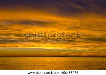 Colorful sunset above the water of Superior Lake, Canada