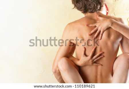 Young couple makes love to the wall