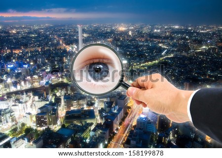 woman eye in magnifying glass