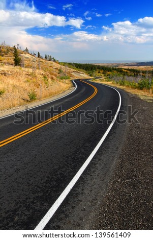Winding road through the rural countryside of Glacier County Montana