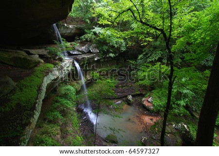 Waterfall flows into a deep canyon in the woodland of northern Alabama