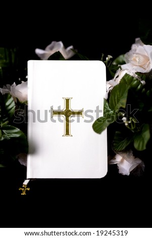 White Bible with Flowers on Black