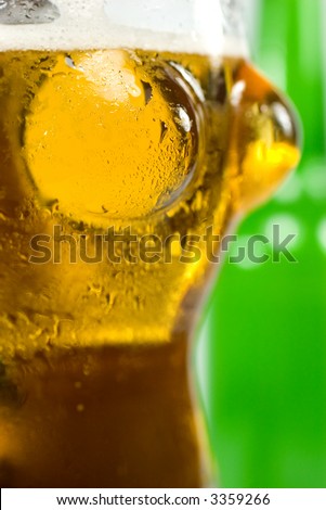 A nice picture of an ice cold beer. The glass is shaped as hot woman. very special.