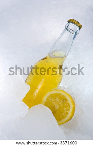 A nice picture of a beerbottle on ice. Very fresh. This version has a lemon.