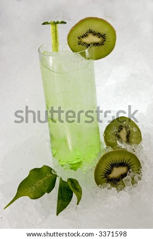 A colorful picture of green beverage. Fresh en cold.
