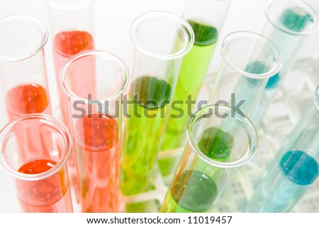 A colorful picture of test tubes in a rack, taken from above
