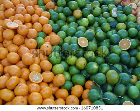 Green and orange mandarin oranges