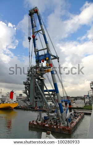 Huge crane barge doing marine heavy lift installation works in the Port of Rotterdam.