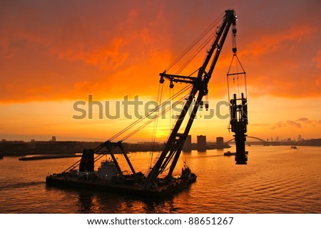 Huge crane barge doing marine heavy lift  installation works in the Port of Rotterdam.