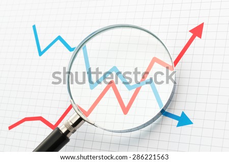 Analyzing upside growing and downside declining arrows chart with magnifying glass. Line graph and magnifying glass. Watching moves.