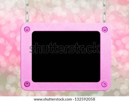 Pink metallic frame picture hanging by chains on isolated bokeh background