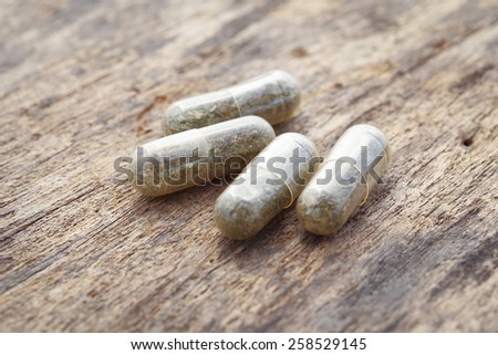 herbal medicine pills on the old wood