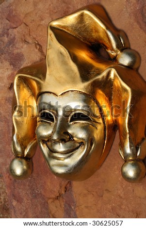 Venetian mask of smiling joker