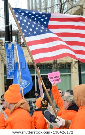 MADISON, WI - MAR 3: Union supporters  in Wisconsin in a rally against Governor Scott Walker\'s budget on Mar 3, 2011. Walker has won the recall election, but he still faces a new election next year