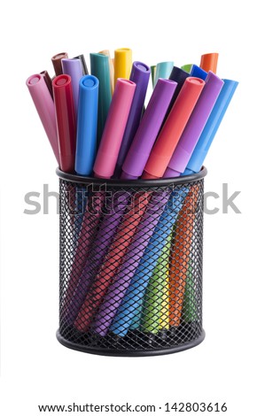 Isolated image of a desk organiser stuffed full of felt tip pen