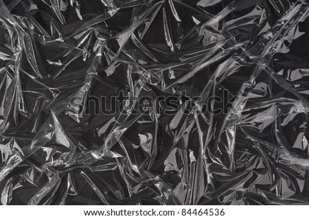 Transparent plastic foil on black background