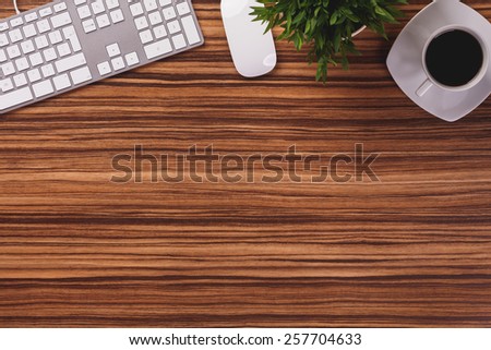 Office equipment on wooden desk.