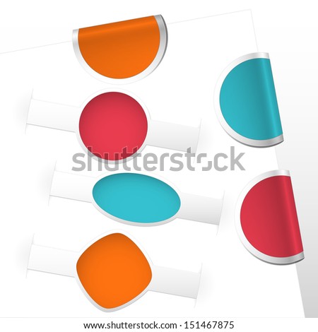 collection of curled label bookmarks and labels colored blue, red, orange