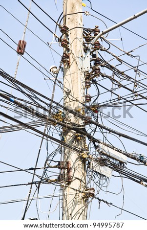 Tangled wires on Electricity post.