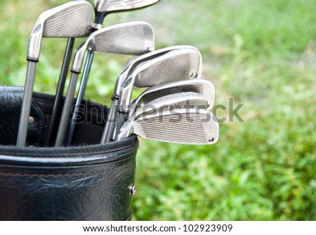 Close up of golf clubs in golf bag