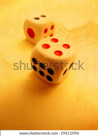 Square dice on old paper background