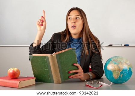 Beauty teacher thinking and reading book