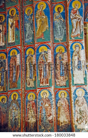Romania, 5th July 2010. Visiting the Monastery Voronet. Details of painted exterior walls. Dominant color is well known blue of Voronet.