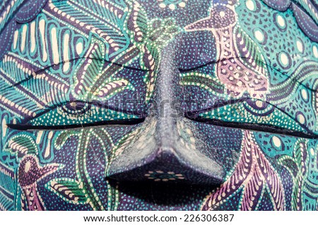 Detail of colored african mask, halloween mask, close up