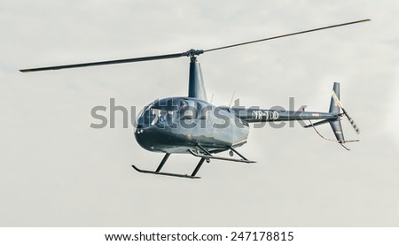 BUCHAREST, ROMANIA - OCTOBER 4, 2014. Aerobatic helicopter pilots training in the sky of the city.