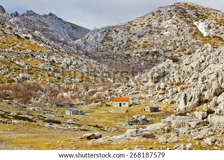 Velebit nature park stone desert and mountain shelter view, Croatia