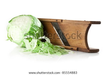 old cabbage slicer and green cabbage