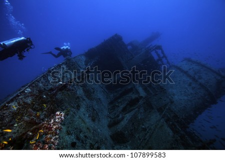 Female technical divers exploring the underwater shipwreck Eagle in the Florida Keys off of Islamorada just south of Key Largo.