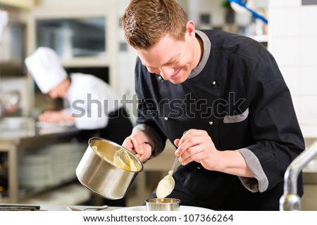 Chef in hotel or restaurant kitchen cooking, he is working on the sauce for the food as saucier