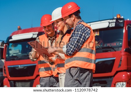 Driver and booker of heavy transport cargo company talking