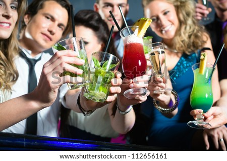 stock-photo-young-people-in-club-or-bar-drinking-cocktails-and-having-fun-