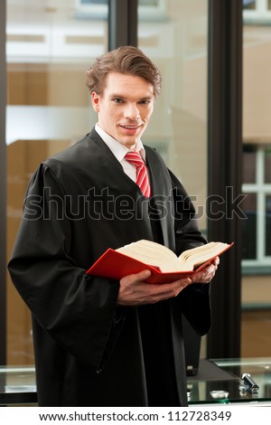 Lawyer with civil law code in a court room