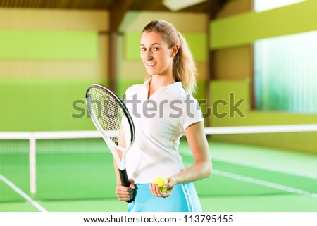 Laughing woman look forward to playing tennis in a court indoors
