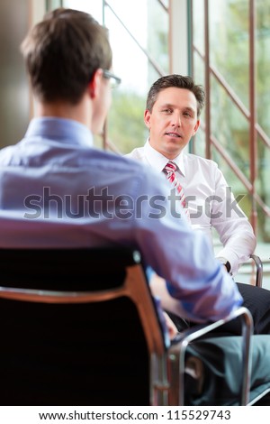 Man having an interview with manager employment job candidate hiring resume CEO work business