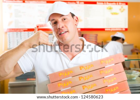 Man holding several pizza boxes in hand and asking you to order pizza for delivery