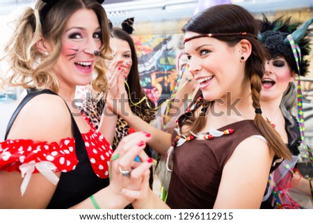 Group of young German women at fasching carnival having costume party