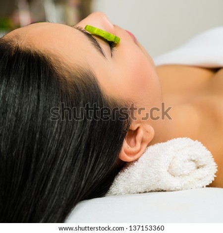Young Asian Woman in a beauty spa getting a treatment for facial Skin Care